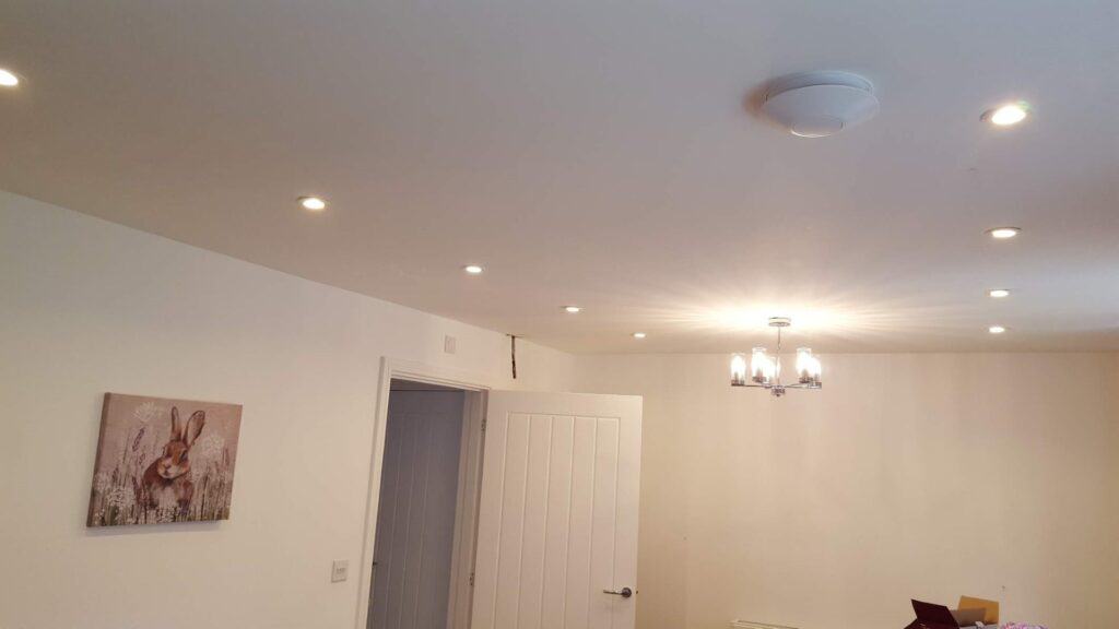 A kitchen ceiling with newly installed downlight/spotlights