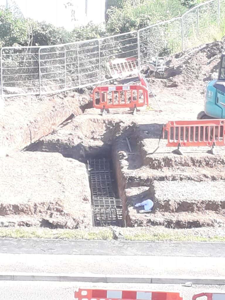 Metal rebar inside dug trenches