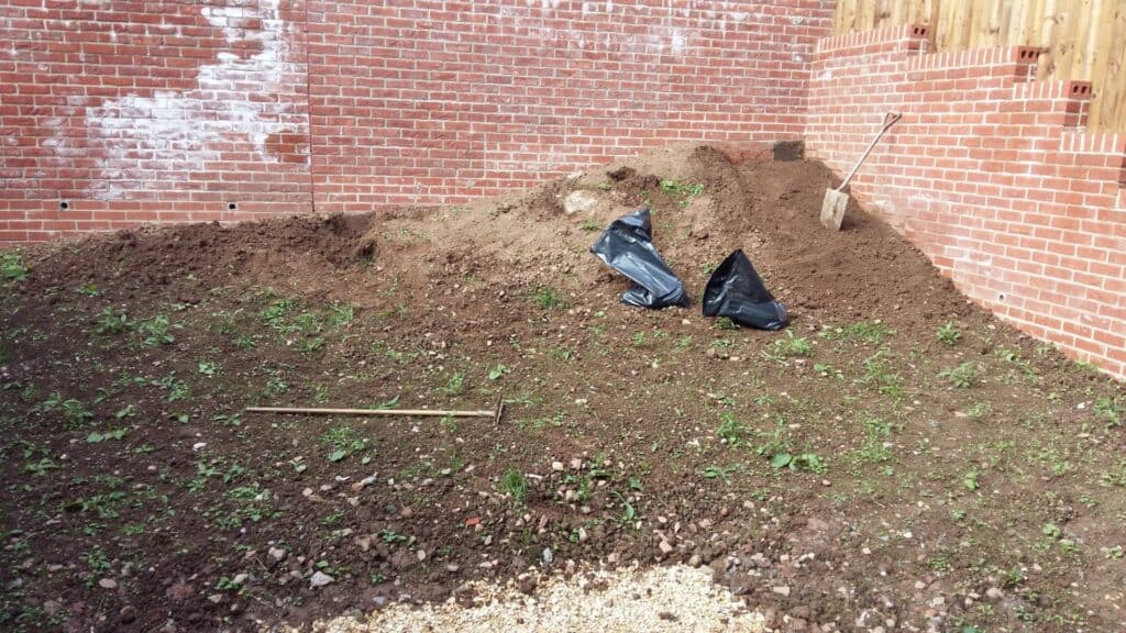 Starting to excavate a backyard with large excess soil