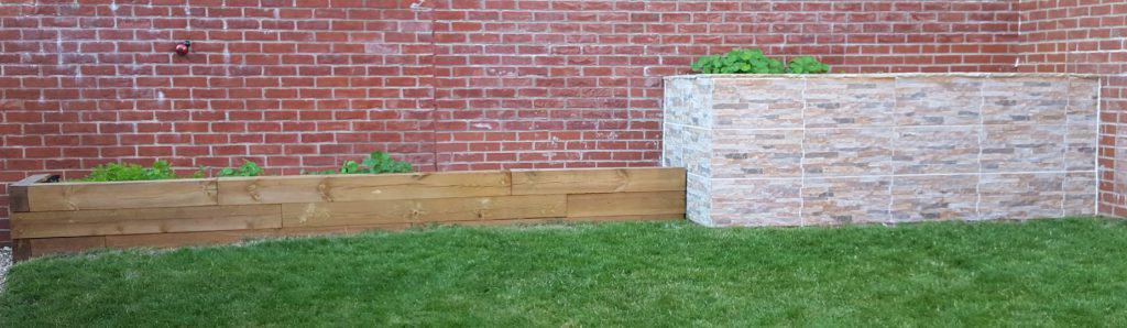 A wood and masonry planter garden next to each other