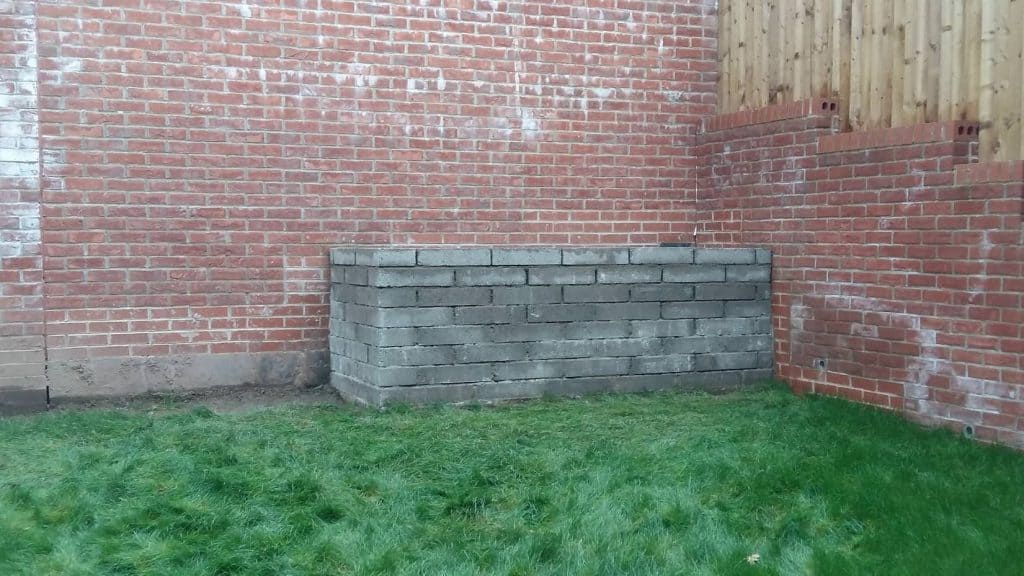 The final height of the masonry flowerbed at around 90cm