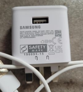 A Samsung phone charger with 100 240V input and 9V DC 1.67 amp 15W output