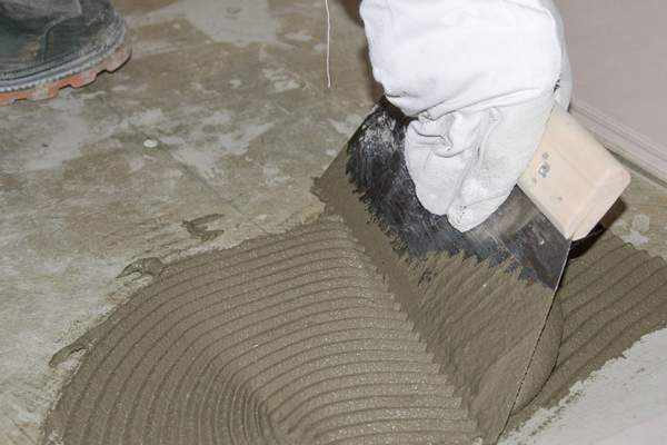 Using Tile Adhesive to Level the Floor